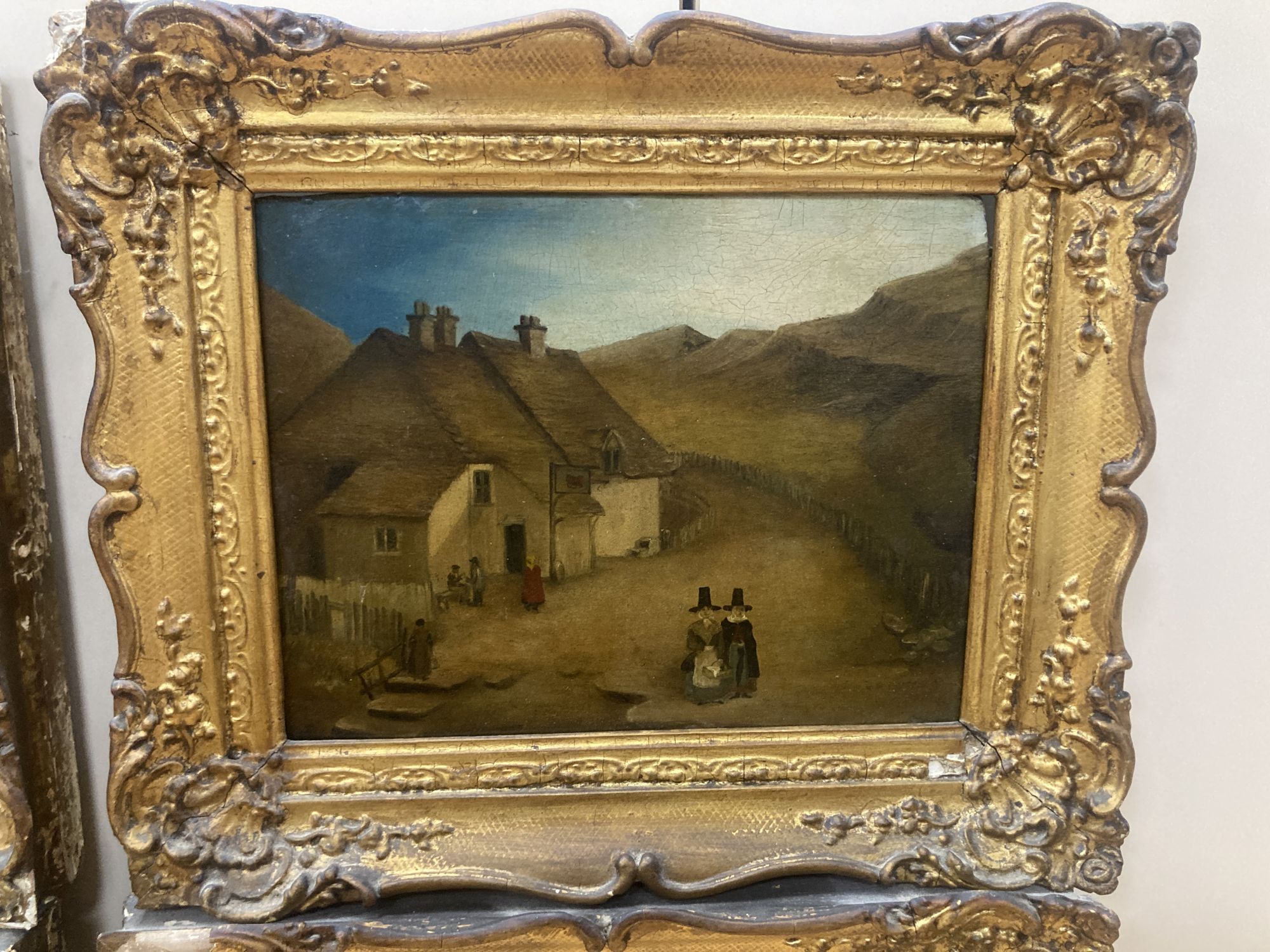 19th century Welsh School, set of 4 oils on panel, Primitive landscapes with figures beside a church, tavern and timber beamed houses,